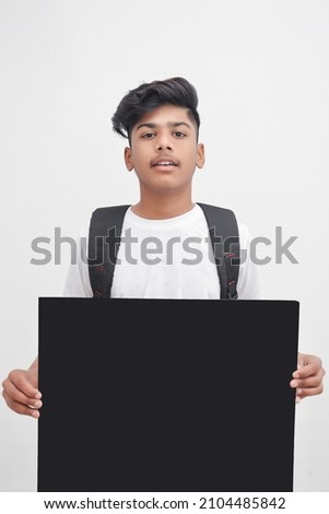 Indian college student showing board on white background.