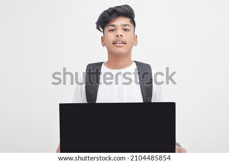 Indian college student showing board on white background.
