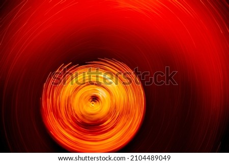 Long exposure concept background photo of bubbles in tea while spinning. The idea of  long exposure, space, time, planets, galaxies, black holes.