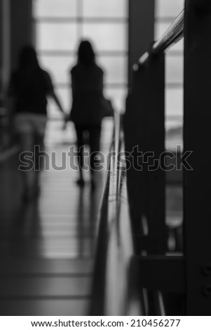 people walk through the hallway in blur