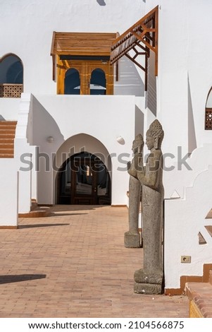 Buddhist statues in front of the hotel entrance for good luck and attraction of tourists to the resort town of Sharm El Sheikh, Egypt, close up