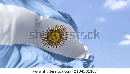 Detailed close up of the national flag of Argentina waving in the wind on a clear day. Democracy and politics. South american country. Selective focus. Royalty-Free Stock Photo #2104581107
