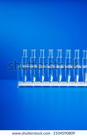 Rack of test tubes with solution on blue counter