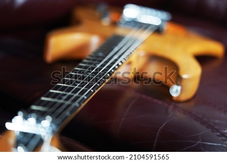 Guitar wallpaper. Musical instrument. Performance. Art. Strings. Electric guitar closeup detail. Music. Play.  Wooden vintage guitar. Ukulele                                                           