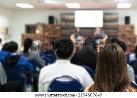 Abstract blurred photo of conference hall or seminar room with attendee background. 
Bokeh business meeting conference training learning coaching