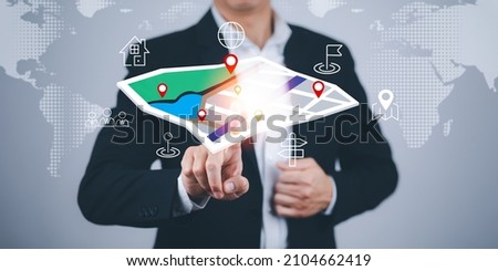 Businessman hand touch virtual world and model map with location point , GPS app, icon Travel maps and find places in the online system, all screen graphics are generated,Searching for travel goals.