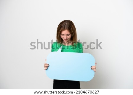 Young English woman isolated on white background holding an empty speech bubble