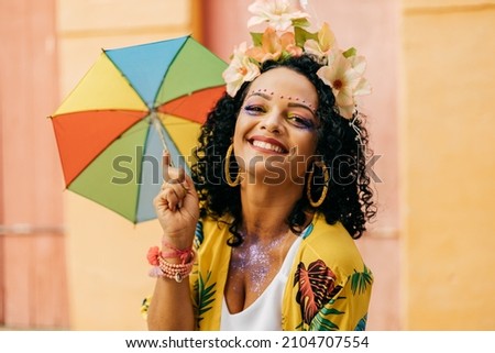Portrait of a Brazilian woman during a carnival block Royalty-Free Stock Photo #2104707554