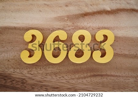 Golden Arabic numerals 3683 on a dark brown to white wood grain background.