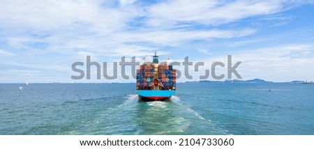 Container ship leaving the industrial seaport, Global business Import export, Company business logistic and transportation international by container cargo freight ship in the open sea. Royalty-Free Stock Photo #2104733060