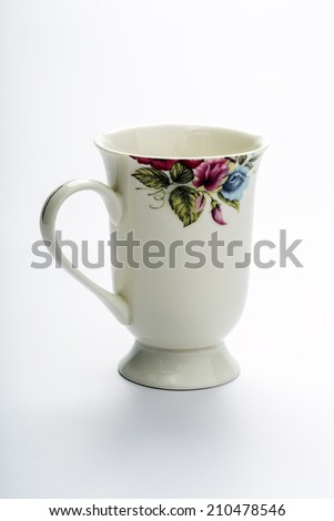 base curb of porcelain - ceramic cup on a white background