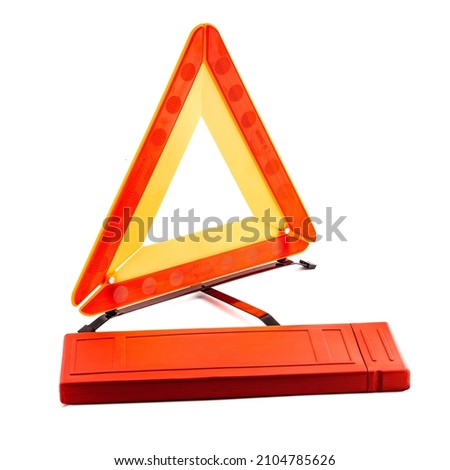 Car emergency reflective triangle sign isolated over white background