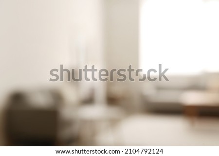 Stylish interior of living room, blurred view