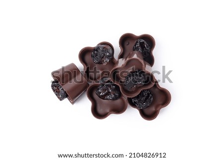 Chocolate candies with raisin isolated on white background