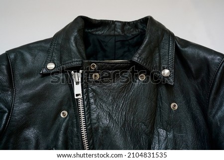 Top of the front of a vintage British rider's jacket. Royalty-Free Stock Photo #2104831535