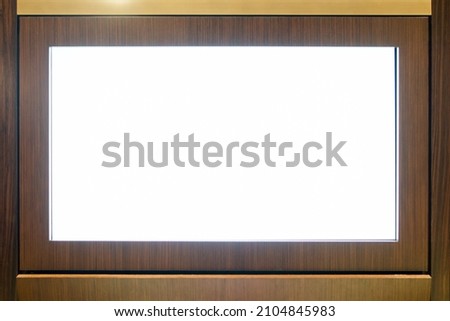 blank led screen on wooden wall