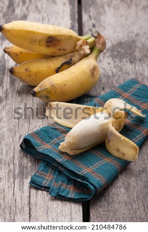 Ripe banana on wood table.