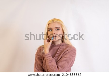 young blonde gestures, gestures, facial expressions, purple jacket