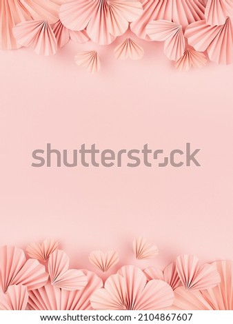Hearts background for Valentines day, wedding - beautiful tender pink paper ribbed hearts in simple origami style soar on pastel pink color as footer, header border, copy space, vertical.  Royalty-Free Stock Photo #2104867607