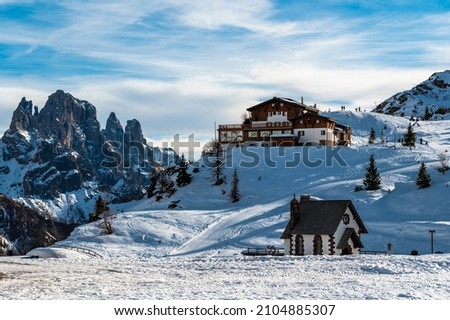 Snowy sunset from Passo Rolle. Pale di San Martino, Dolomites. Royalty-Free Stock Photo #2104885307
