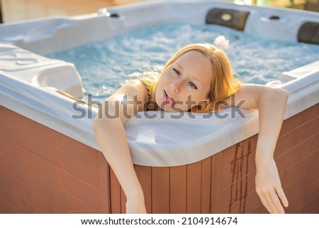 Funny humor photo. Portrait of young carefree happy smiling woman relaxing at hot tub during enjoying happy traveling moment vacation life against the background of green big mountains