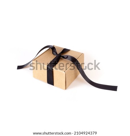 One craft boxes with black bow and ribbon isolated on white background