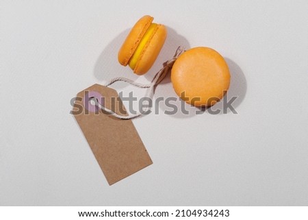 Macarons and mockup tag on grey background, St. Valentines day concept