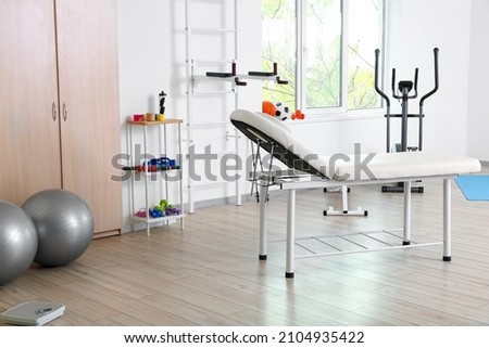 Workplace of physiotherapist in rehabilitation center Royalty-Free Stock Photo #2104935422