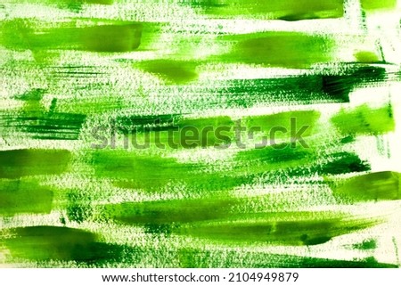 Horizontal green watercolor lines on white paper background. Antistress. Art therapy. Selective focus. Hand drawn gouache painting