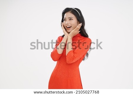 Vietnamese young lady in traditional robe for Lunar New Year Festival Season Royalty-Free Stock Photo #2105027768