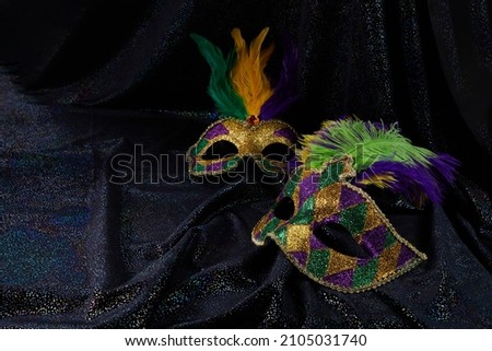 Carnival Mardi gras mask on black glitter background