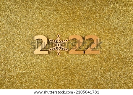 Happy New Year 2022 poster. Christmas background with big gold 2022 numbers. Merry Christmas and Happy New Year. Christmas, winter, new year concept. Greeting card, banner with place for text