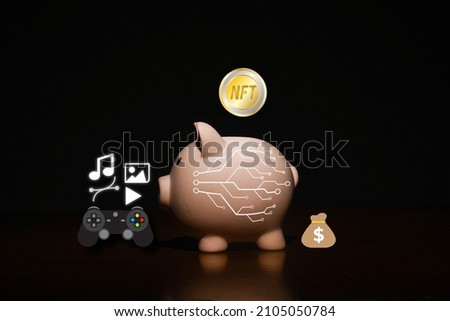 A picture of NFT token entering piggy bank with item that can sell in it. Create income with non fungible token and crypto art.