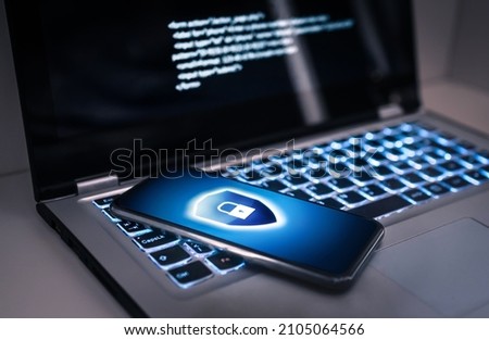 Phone lock to protect from cyber scam, online data fraud or identity theft. Laptop with hacker virus code in screen. Phishing, cybersecurity danger or ransomware attack. Encrypted privacy in email. Royalty-Free Stock Photo #2105064566