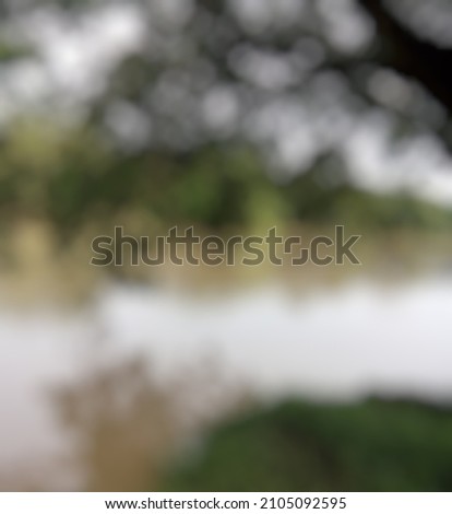 unfocused, blur photography. View of lake and trees blur photography.