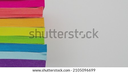 A stack of colorful sticky note pads