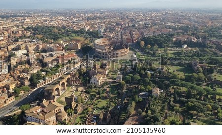 Aerial drone view of iconic and beautiful ancient Arena of Colosseum, also known as the Flavian amphitheatre in the heart of Rome, Italy