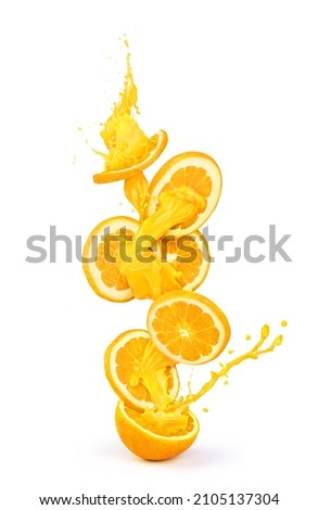 Orange juice flows through orange slices isolated on white background Royalty-Free Stock Photo #2105137304