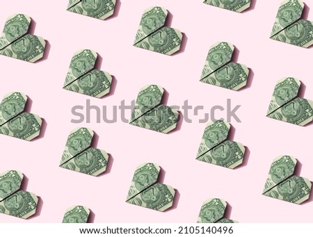 Origami heart dollar plane seamless isometric pattern on pastel pink background. Business, finance, money making minimal concept wallpaper.