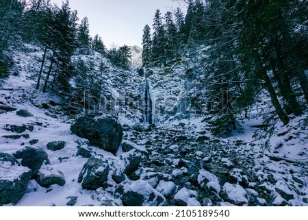 Waterfall Siklawica at winter time.Tatra Mountains in Poland, near Zakopane, Europe.