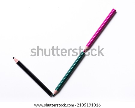 colored pencils forming a check mark isolated on a white background, geometric shapes on a white background