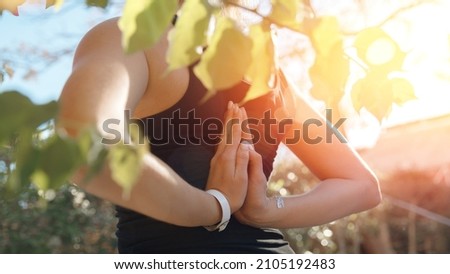 Concept banner asana yoga. Closeup hand of caucasian young woman sitting and meditating sunlight background.