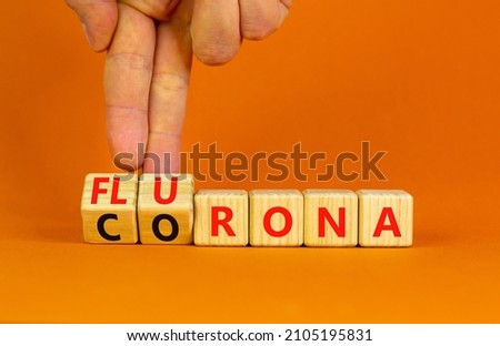 Covid-19 corona and flu flurona symbol. Doctor turns cubes and changes the word corona to flurona. Beautiful orange background. Medical, covid-19 corona and flu flurona concept. Copy space.
