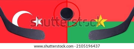 Top view hockey puck with Turkey vs. Burkina Faso command with the sticks on the flag. Concept hockey competitions