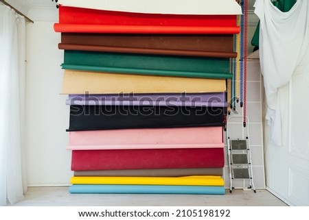 Lots of multicolored paper phonof equipment photo studio for photographer
