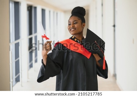 beautiful african female student with graduation certificate