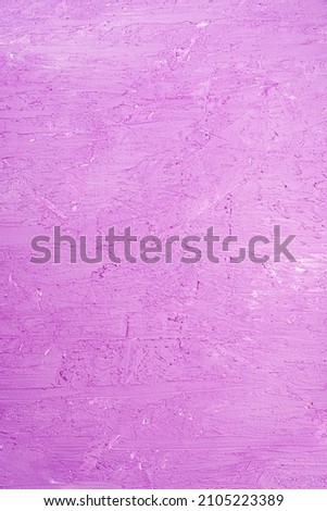 Old wall with peeling stucco. Craquelure purple textured background. Abstract concrete interior. Vertical photo