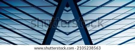 Abstract architecture. Ceiling of modern public or office building. Glass panels and metal frames. Close-up photo of financial business real estate. Geometric structure of triangles and parallel lines