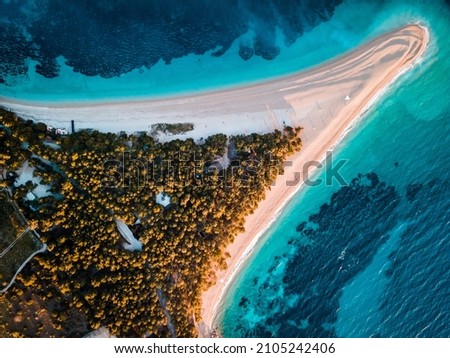Croatia, Hvar island, Bol. Aerial view at the Zlatni Rat. Beach and sea from air. Famous place in Croatia. Summer seascape from drone. Royalty-Free Stock Photo #2105242406