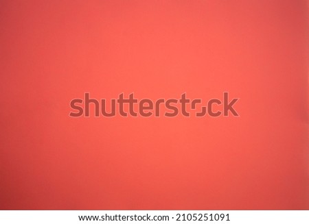 Photo of a pink background texture. A blank pink cardboard sheet, an empty space for text.